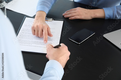 Bank manager working with m...