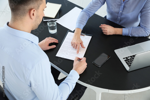 Bank manager working with m...