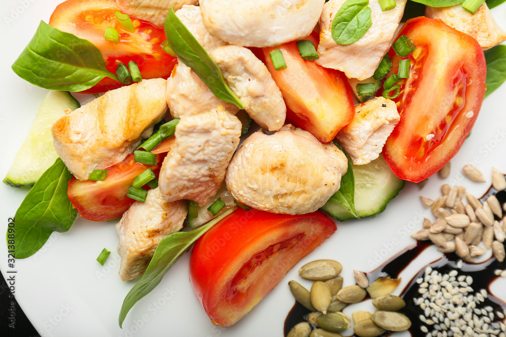 Plate with tasty chicken salad on table, closeup Plate with tasty chicken salad on table, closeup