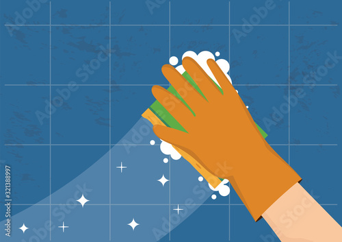 Hand in gloves with yellow sponge wash wall.