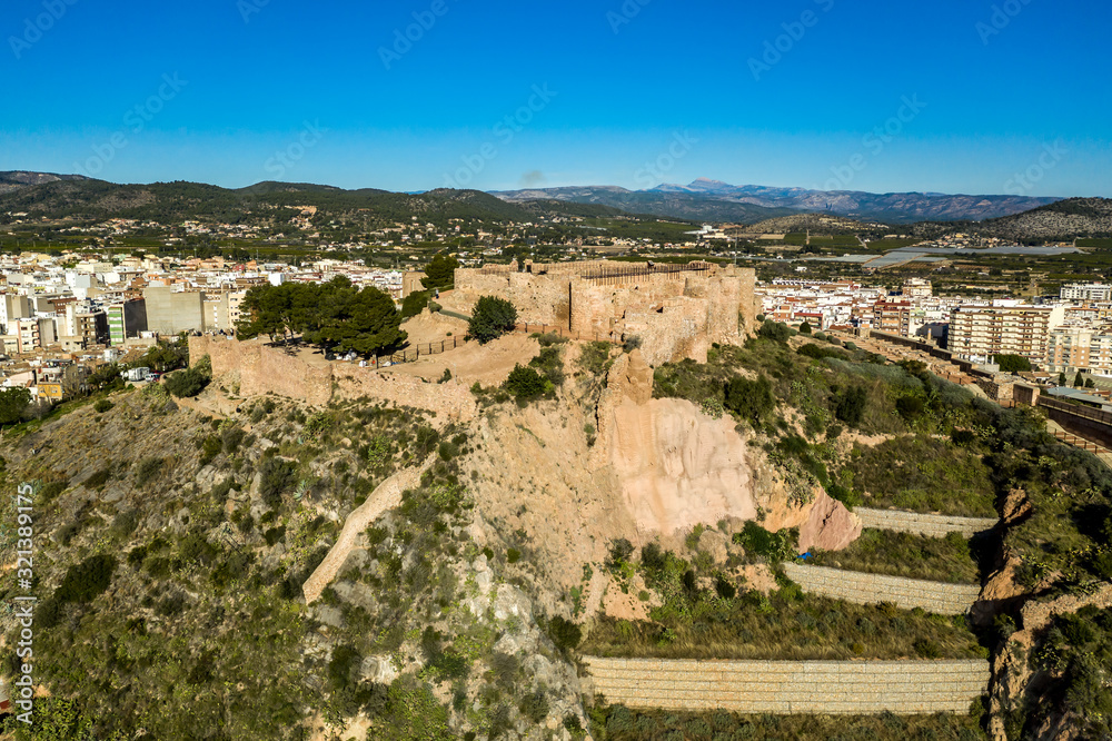 Aerial view of medieval Onda partially restored medieval castle ruin in Spain with concentric walls, semi circular towers, inner and outer bailey