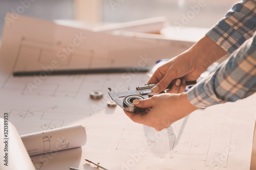 Female architect working in...