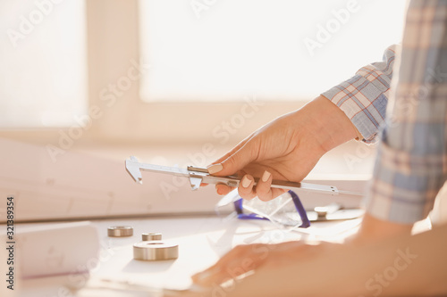 Female architect working in...