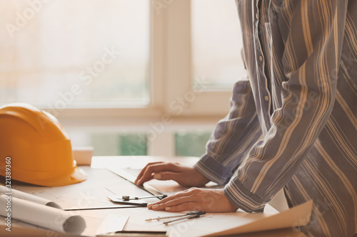 Female architect working in...