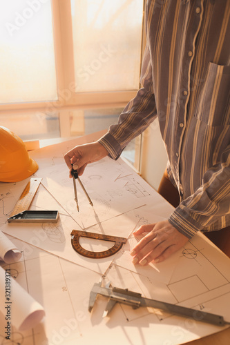 Female architect working in...