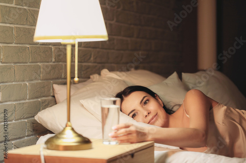Beautiful young woman takin...