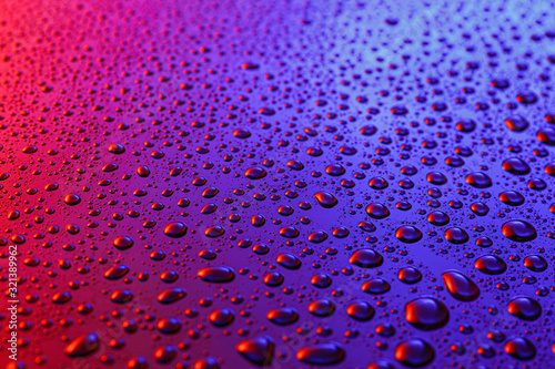 Water drops on color background