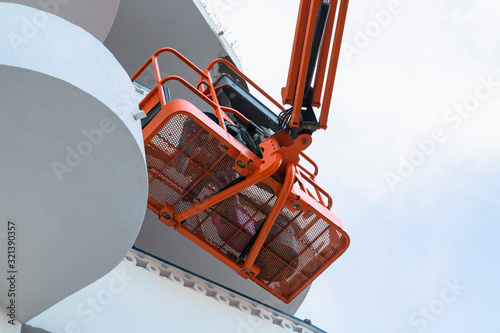 Man on a telescopic boom lift platform