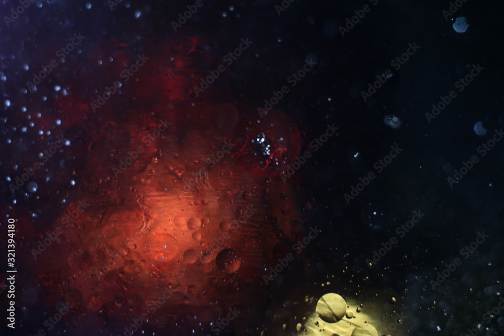 Cosmic abstraction background red interstellar cloud in the universe and a small yellow satellite