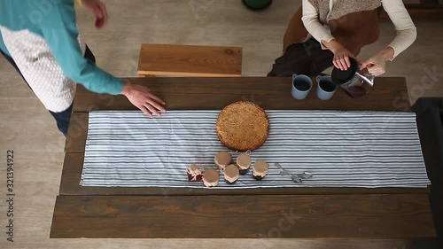 A man in an apron serves pie for breakfast