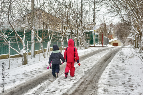 Children in warm clothes on a walk on a cold winter day