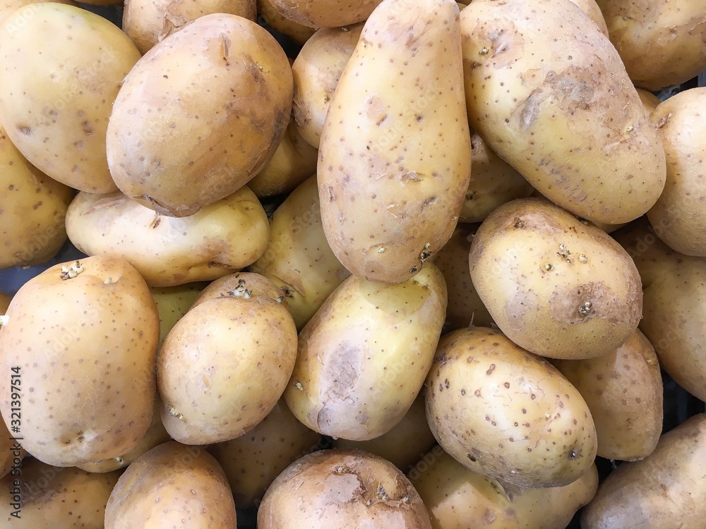 Fresh potatoes set as a background in market.Healthy eating. Fresh potatoes set as a background in market.Healthy eating.