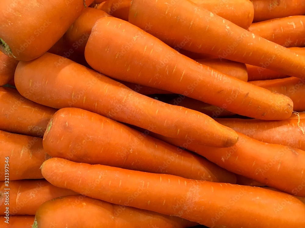 Texture background of fresh large orange carrots in the market. Can be used for wallpaper Texture background of fresh large orange carrots in the market. Can be used for wallpaper