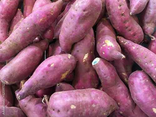 Fresh purple yams pile. Sweet potato. Fresh yams.