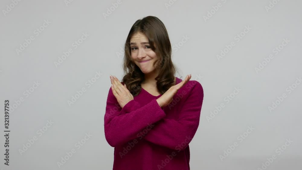 Never again, no way more! Nice-looking brunette woman in pullover saying no and crossing hands, showing x sign meaning stop, prohibited, forbidden to do. indoor studio shot isolated on gray background Never again, no way more! Nice-looking brunette woman in pullover saying no and crossing hands, showing x sign meaning stop, prohibited, forbidden to do. indoor studio shot isolated on gray background