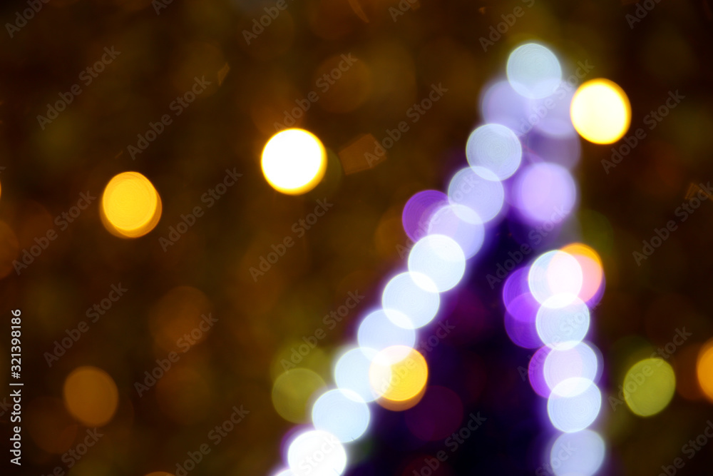 blurred golden circles of lights. defocused lights of festive garland blurred golden circles of lights. defocused lights of festive garland