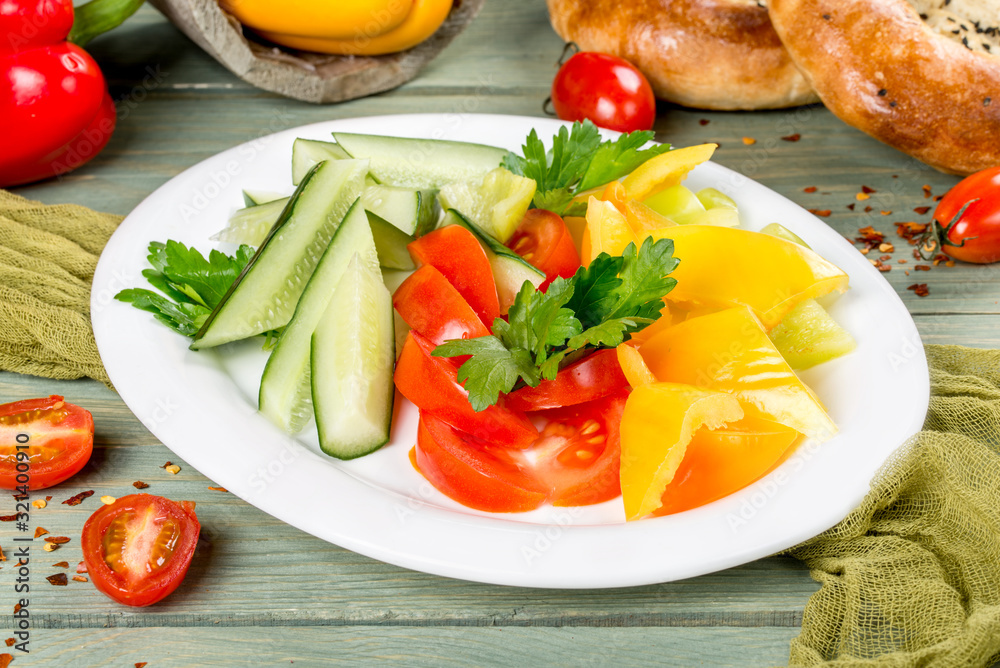 Vegetable plate with cucumbers, tomatoes and peppers Vegetable plate with cucumbers, tomatoes and peppers