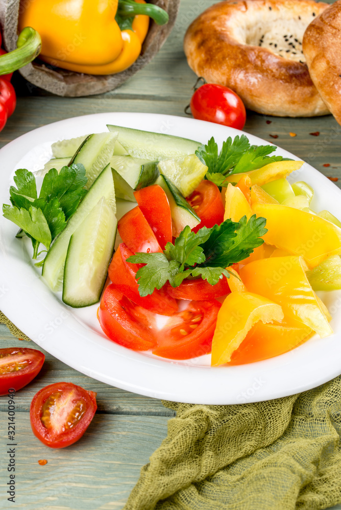 Vegetable plate with cucumbers, tomatoes and peppers