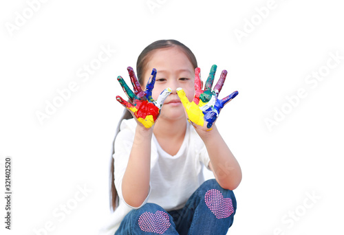 Little girl with colorful hands painted isolated on white background. Focus at child hands