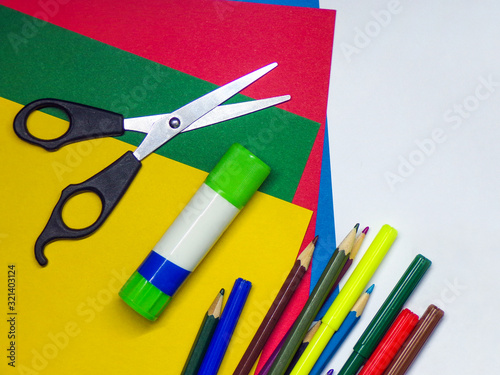 School background primary school template for designer. Colored paper glue scissors and markers for creative work.