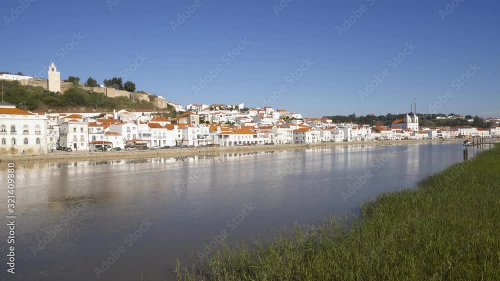 View of Alcacer do Sal cityscape from the other side of the Sado river View of Alcacer do Sal cityscape from the other side of the Sado river