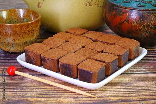 Nama chocolate is a type of ganache, made from a mix of melted cacao and fresh cream. As the mixture solidifies, the block of chocolate is cut into pieces and sprinkled with cocoa powder on top.