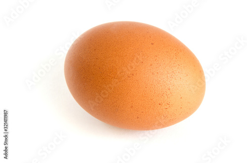 Homemade chicken egg on a white background with shadow