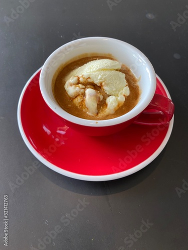 Wallpaper Mural red cup of espresso coffee with vanila icecream on black table background. Torontodigital.ca