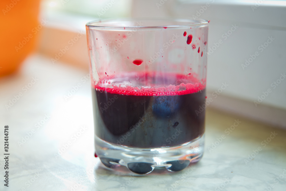 Fresh juice just made from beetroot a glass shot from bird-eye-perspective isolated on white background . Glass of beet juice isolated on white . Fresh juice just made from beetroot a glass shot from bird-eye-perspective isolated on white background . Glass of beet juice isolated on white .