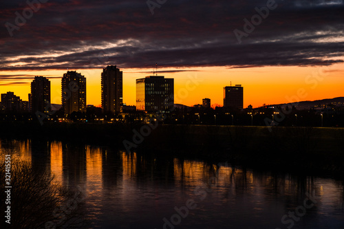 Sunset over Sava river in Zagreb, Croatia, dramatic cloudy sky 