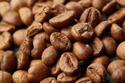 Roasted coffee beans close up. Espresso dark, aroma, black caffeine drink