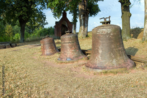 Church bells laid in the landscape photo