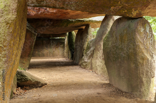 Fotografie, Tablou Inside a prehistoric burial chamber or Dolmen La Roche aux Fees