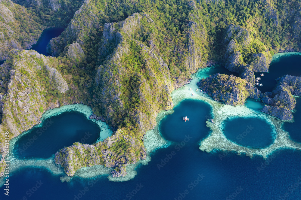 View from above, stunning aerial view of the Twin Lagoons surrounded by rocky cliffs. The Twin Lagoons are one of the must-see destinations in Coron Island. Palawan, Philippines.