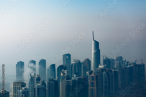 Dubai skyline  an impressive aerial top view of the city in Dubai Marina on a foggy day. October 2019