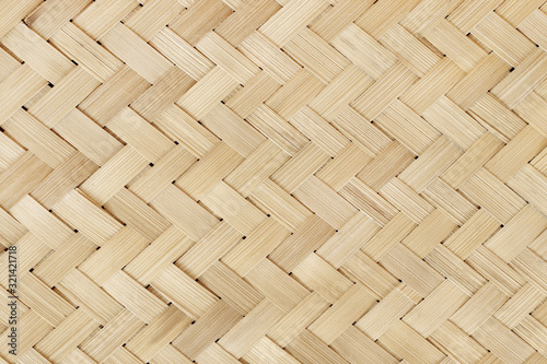 Old bamboo weaving pattern, woven rattan mat texture for background and design art work. photo