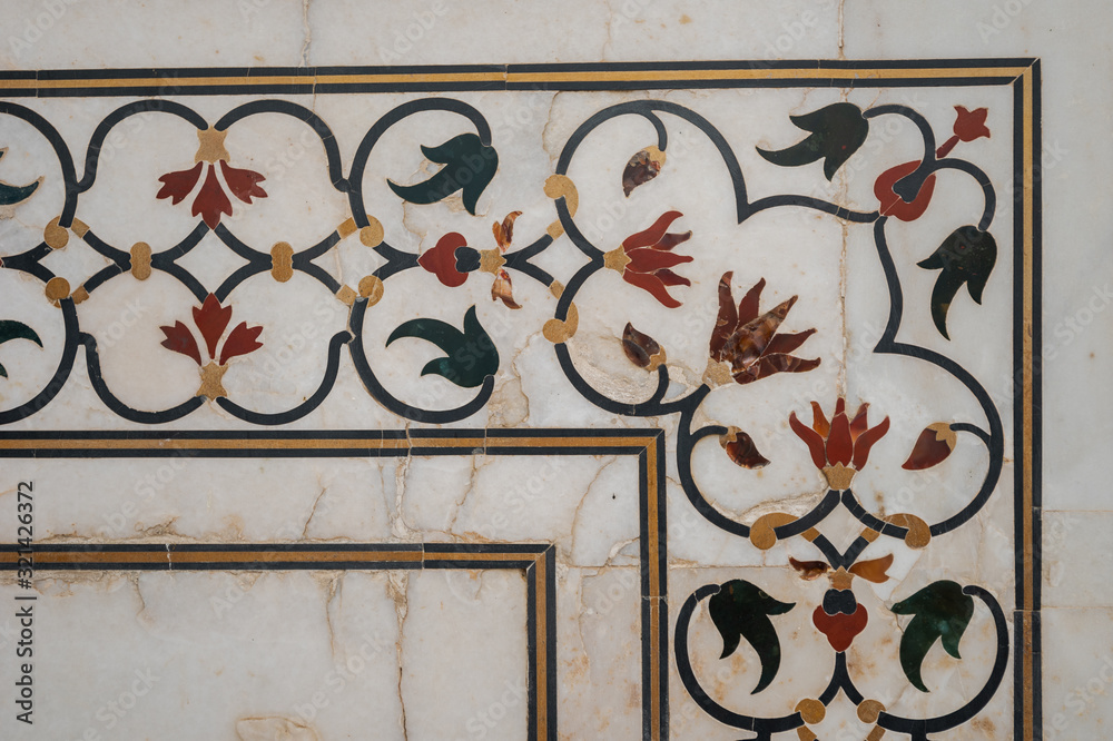 Detail of architectural decoration made of white marble, onyx and other stones on the Taj Mahal in Agra, India