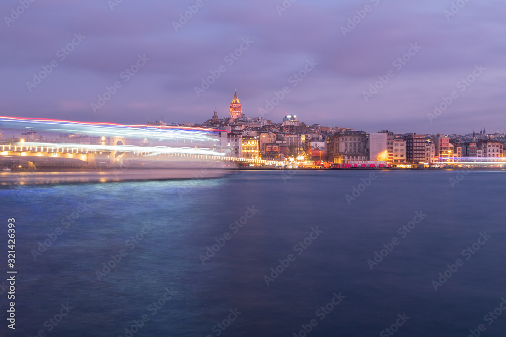 Istanbul, Turkey - Jan 15, 2020: Galata Tower with Ferry Boat in Golden Horn , Istanbul, Turkey, Istanbul, Turkey - Jan 15, 2020: Galata Tower with Ferry Boat in Golden Horn , Istanbul, Turkey,