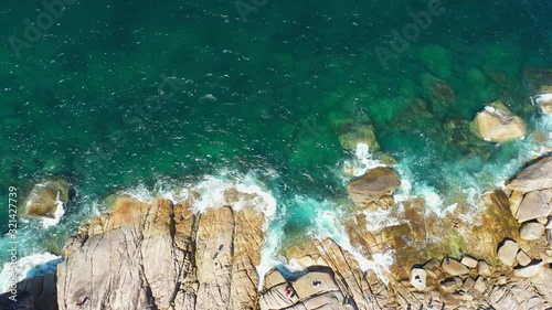 Footage B-roll of Aerial view drone shot ocean waves, Beautiful tropical beach and rocky coastline and beautiful forest. Nga Khin Nyo Gyee Island Myanmar. Tropical seas and islands in southern Myanmar photo