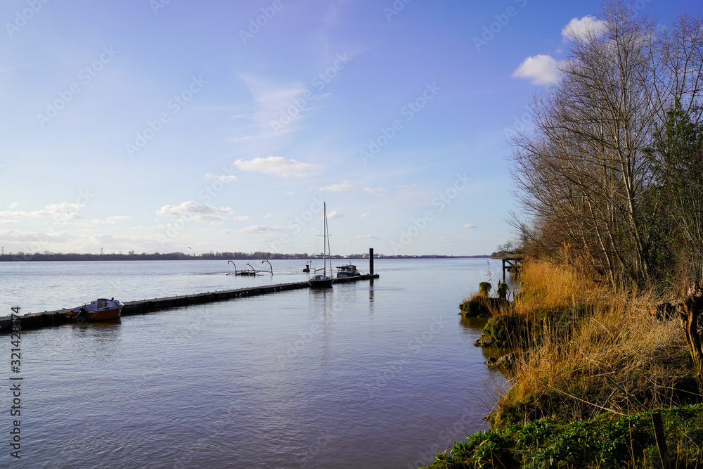 panorama of a pontoon for mooring boats in winter garonne river france