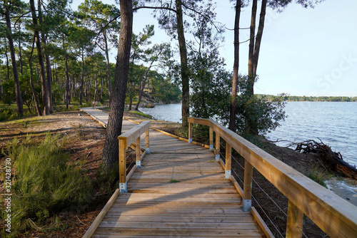 Wooden pontoon pier boards to hourtin beach lake water in Maubuisson Carcans France