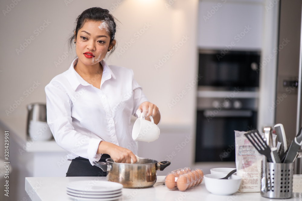 The woman was pouring water into the bowl The woman was pouring water into the bowl