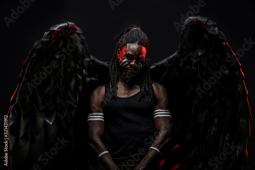 portrait of black african angel, gothic dark angel for peace in the human world, angel suppresses a demon within every living being. isolated photoshoot photo