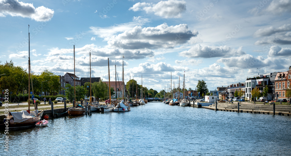 Boats and sailing ships in the small harbor in Greifswald, Mecklenburg Western Pomerania, Germany