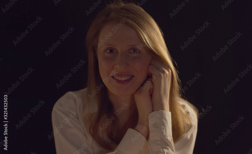 Portrait of a pretty young woman on a dark background Portrait of a pretty young woman on a dark background