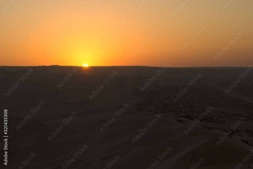 Sunset in Huacachina desert, Peru
