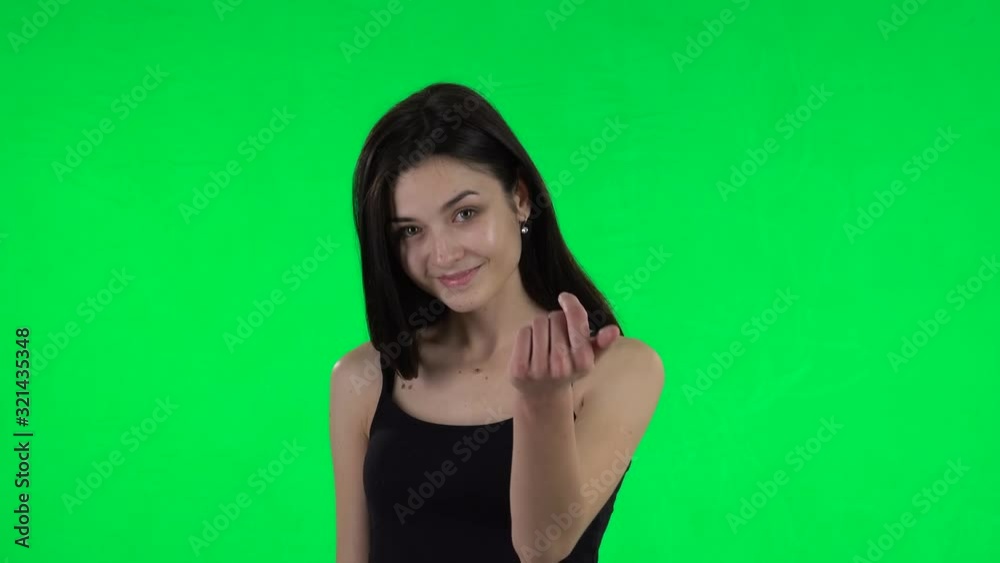 Young girl waving hand and showing gesture come here. Green screen Young girl waving hand and showing gesture come here. Green screen