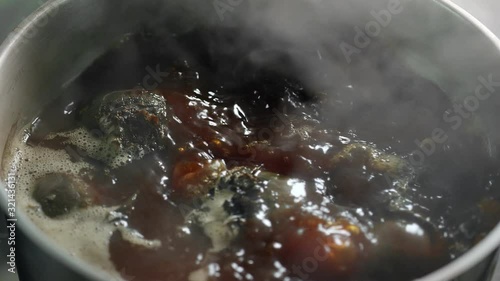 Top view fresh beet cooking at boiling water pan slow motion. Close up shot on 4k RED camera photo