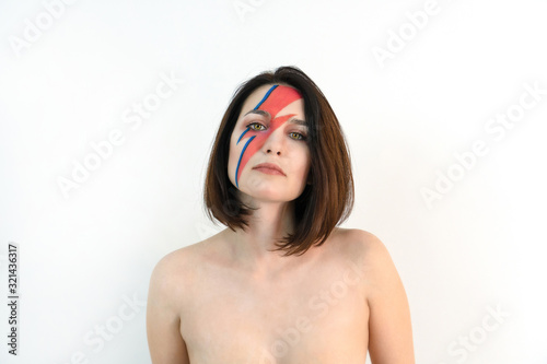 Billede på lærred red and blue lightning bolt on her beautiful face