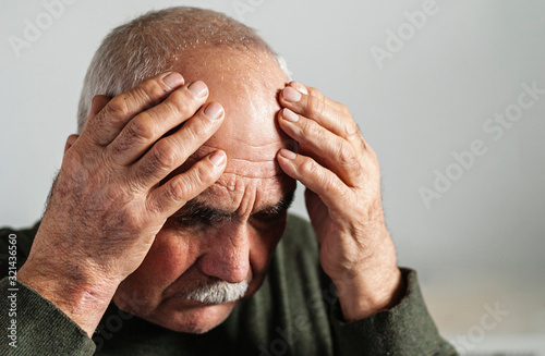 Elderly man feeling unwell or with dementia